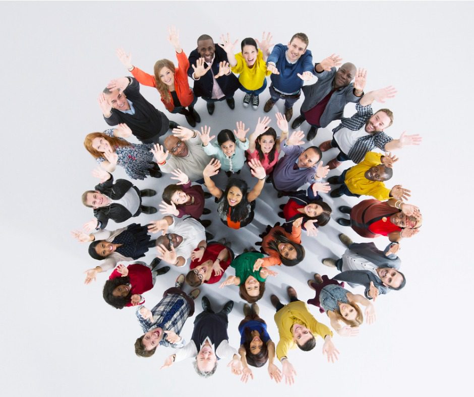 Group of people raising their hands