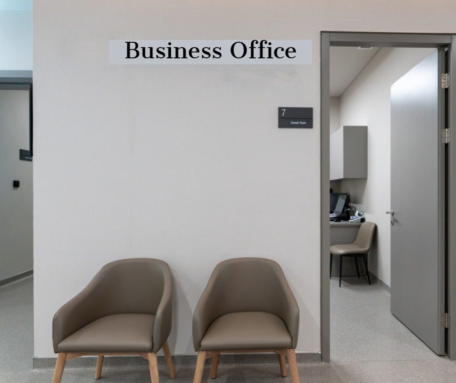 Two chairs in front of a business office door.