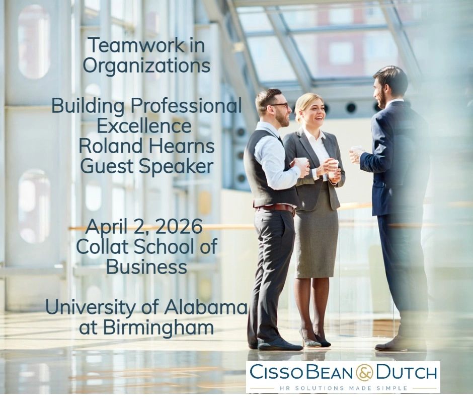 Business professionals conversing in modern office.