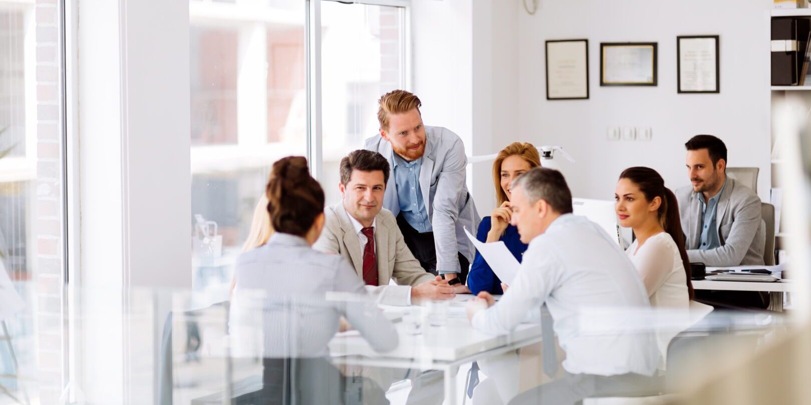 A group of people sitting around a table.